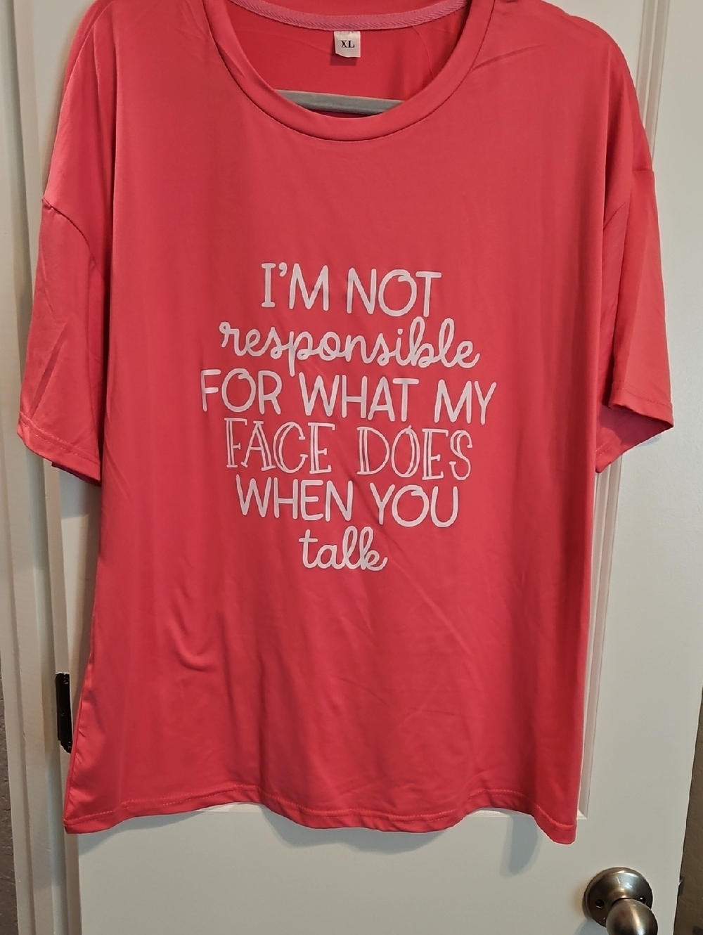 Source Unknown Coral Short Sleeve Tee with White Slogan